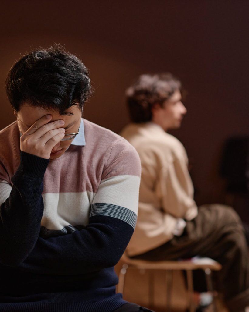 depressed-man-during-group-therapy-2023-11-27-05-29-13-utc-min